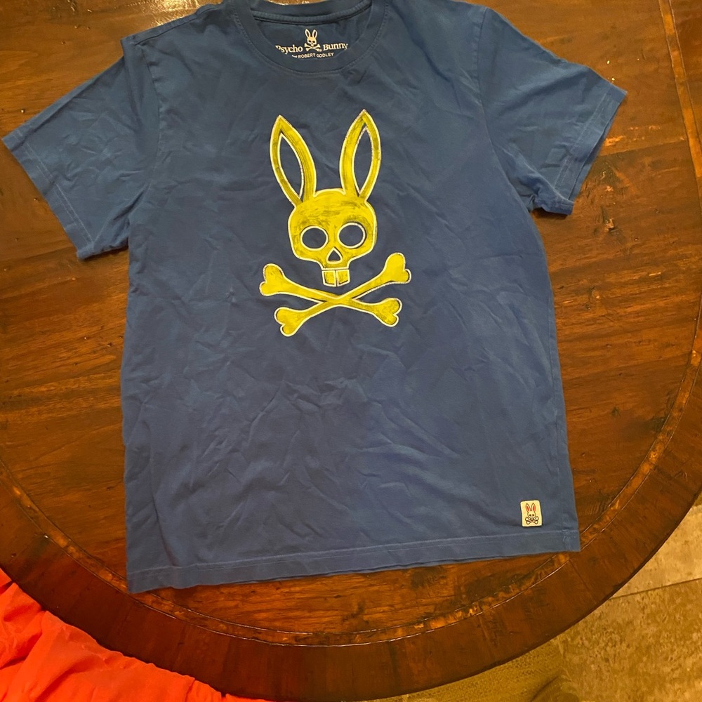 Psycho Bunny printed blue shirt. More royal blue. Did not photograph well